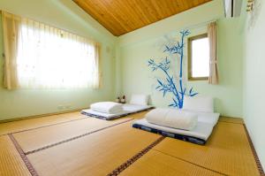 Postel nebo postele na pokoji v ubytování 雲庭民宿 Yunting B&B