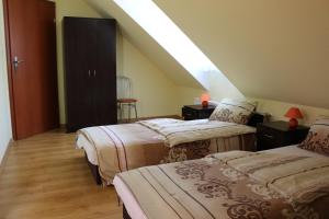 Un pat sau paturi într-o cameră la Agroturystyka 'Milena'