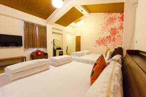 Postel nebo postele na pokoji v ubytování 雲庭民宿 Yunting B&B