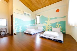 Postel nebo postele na pokoji v ubytování 雲庭民宿 Yunting B&B