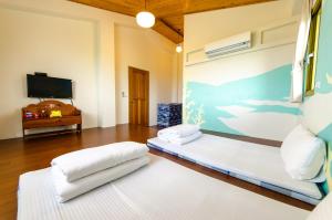 Postel nebo postele na pokoji v ubytování 雲庭民宿 Yunting B&B