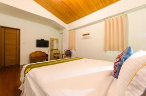 Postel nebo postele na pokoji v ubytování 雲庭民宿 Yunting B&B