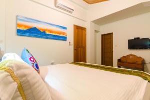 Postel nebo postele na pokoji v ubytování 雲庭民宿 Yunting B&B