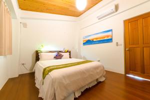 Postel nebo postele na pokoji v ubytování 雲庭民宿 Yunting B&B