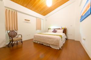 Postel nebo postele na pokoji v ubytování 雲庭民宿 Yunting B&B