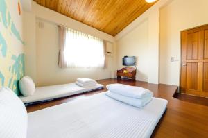 Postel nebo postele na pokoji v ubytování 雲庭民宿 Yunting B&B