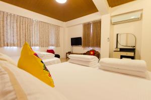 Postel nebo postele na pokoji v ubytování 雲庭民宿 Yunting B&B