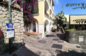 a building with a sign on the side of a street at Casa L'Agave in Capri