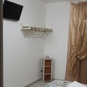 TV a/nebo společenská místnost v ubytování Quarantotto B&B