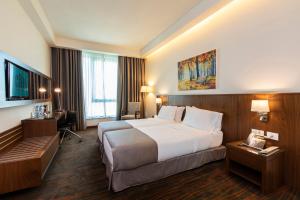 Ένα ή περισσότερα κρεβάτια σε δωμάτιο στο Citea Apart Hotel