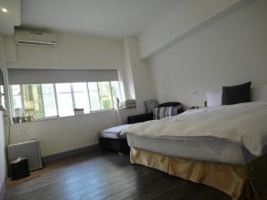 Postel nebo postele na pokoji v ubytování 237 Hotel
