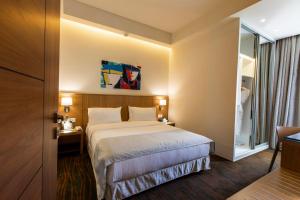 Ένα ή περισσότερα κρεβάτια σε δωμάτιο στο Citea Apart Hotel