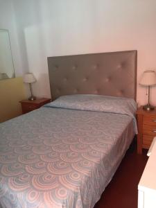 A bed or beds in a room at Casa Mila