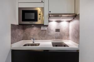Η κουζίνα ή μικρή κουζίνα στο Citea Apart Hotel
