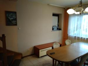 a dining room with a table and a table and chairs at Zajazd Arka 2 in Łódź