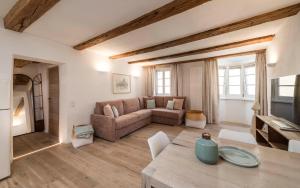 a living room with a couch and a table at Apartment Valentina in Bressanone