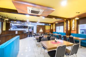A restaurant or other place to eat at Hotel Lok Sagar Mysore