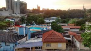 an overhead view of a city with a swimming pool at Casarão do DU in Campinas