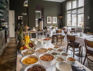 a buffet of food on a table in a restaurant at Hotel Art Nouveau am Kurfürstendamm in Berlin