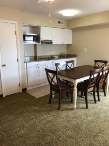 a kitchen and dining room with a table and chairs at Biscayne Family Resort in Wildwood Crest
