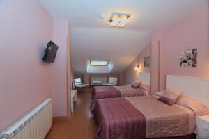A bed or beds in a room at Hotel HC Sigüenza
