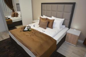 Postel nebo postele na pokoji v ubytování Apart Hotel Family