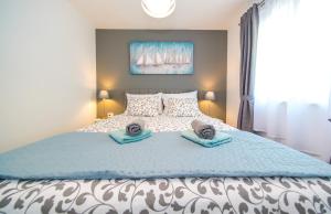 Postel nebo postele na pokoji v ubytování Apartmani Ponta