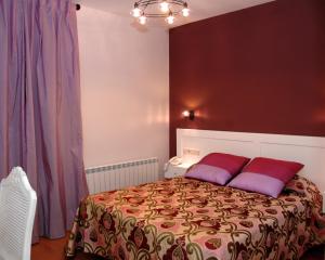 A bed or beds in a room at Hotel HC Sigüenza