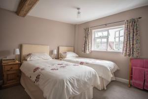 Llit o llits en una habitació de Old Beams Bed & Breakfast