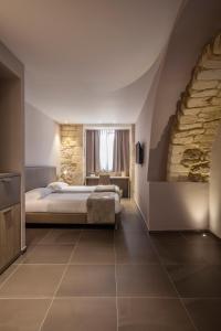 Postel nebo postele na pokoji v ubytování San Giorgio Palace Hotel Ragusa Ibla