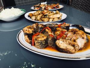 a table with three plates of food on it at Casa Lenuta in Mila Douăzeci şi Trei