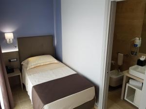 Krevet ili kreveti u jedinici u okviru objekta Netum Hotel