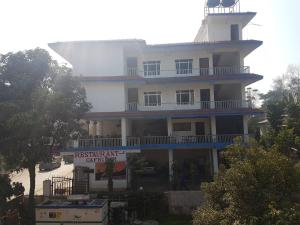 a building with a lighthouse on top of it at Hotel Shiva's Dream in Sauraha
