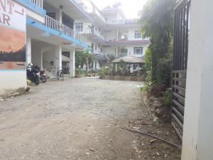 an empty street in front of a building at Hotel Shiva's Dream in Sauraha