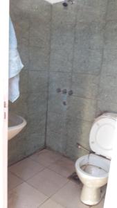 a bathroom with a toilet and a shower at Casa particular Flavio in Salta