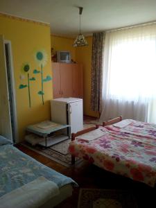 Postel nebo postele na pokoji v ubytování Keletifény Vendégház + 19 fotografií
