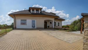 a small white house with a roof at ubytování u Smolíků in Třeboň
