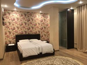 Кровать или кровати в номере Apartment Vanilnoe Nebo