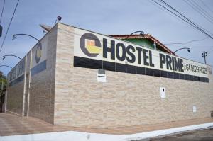 a building with a ghostle prime sign on it at Hostel Prime in Rio Verde