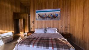 Postel nebo postele na pokoji v ubytování Casas Martín Pescador, Lago Huillinco, Chiloe