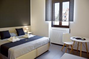Postel nebo postele na pokoji v ubytování Porta Piccola Residence
