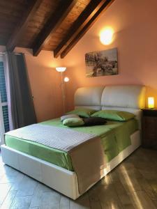 A bed or beds in a room at New Attic Lake View 2