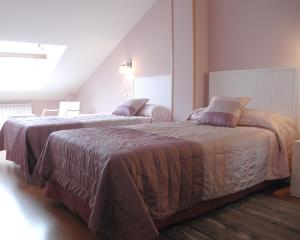 A bed or beds in a room at Hotel HC Sigüenza