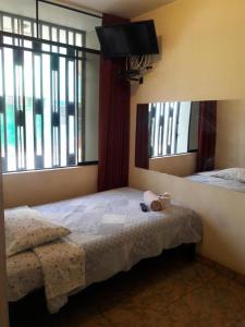 Кровать или кровати в номере Hostal Kmr