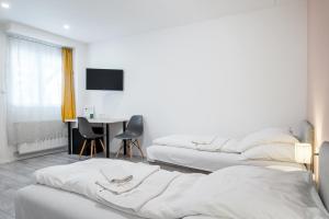 Ένα ή περισσότερα κρεβάτια σε δωμάτιο στο Chesscom Guesthouse