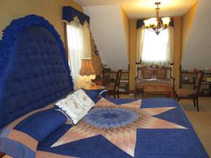 a bedroom with a blue bed with a star on it at Oceanhillside B&B in Digby