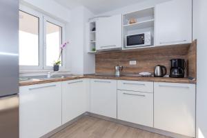 Kuchyň nebo kuchyňský kout v ubytování Apartments Kiara