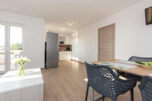 Kuchyň nebo kuchyňský kout v ubytování Apartments Kiara