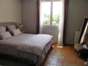 Postel nebo postele na pokoji v ubytování La Bastide du Bouchou