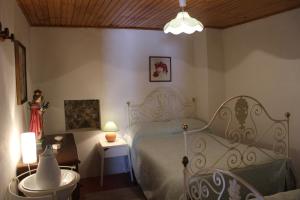 Tempat tidur dalam kamar di Casa Cimo Vila